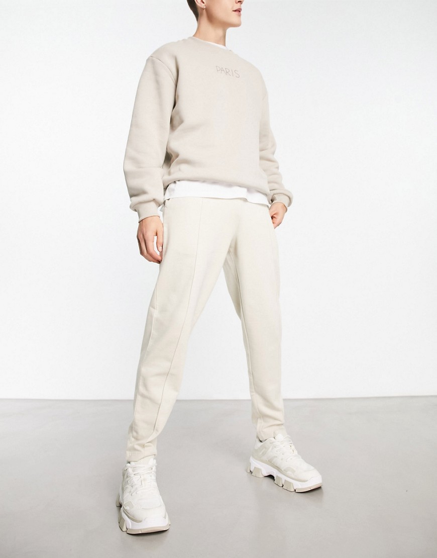 ASOS DESIGN tapered with pintucks sweatpants in beige-Neutral