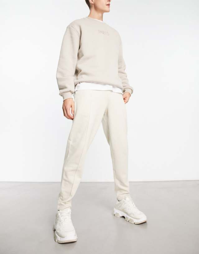 ASOS DESIGN tapered with pintucks sweatpants in beige