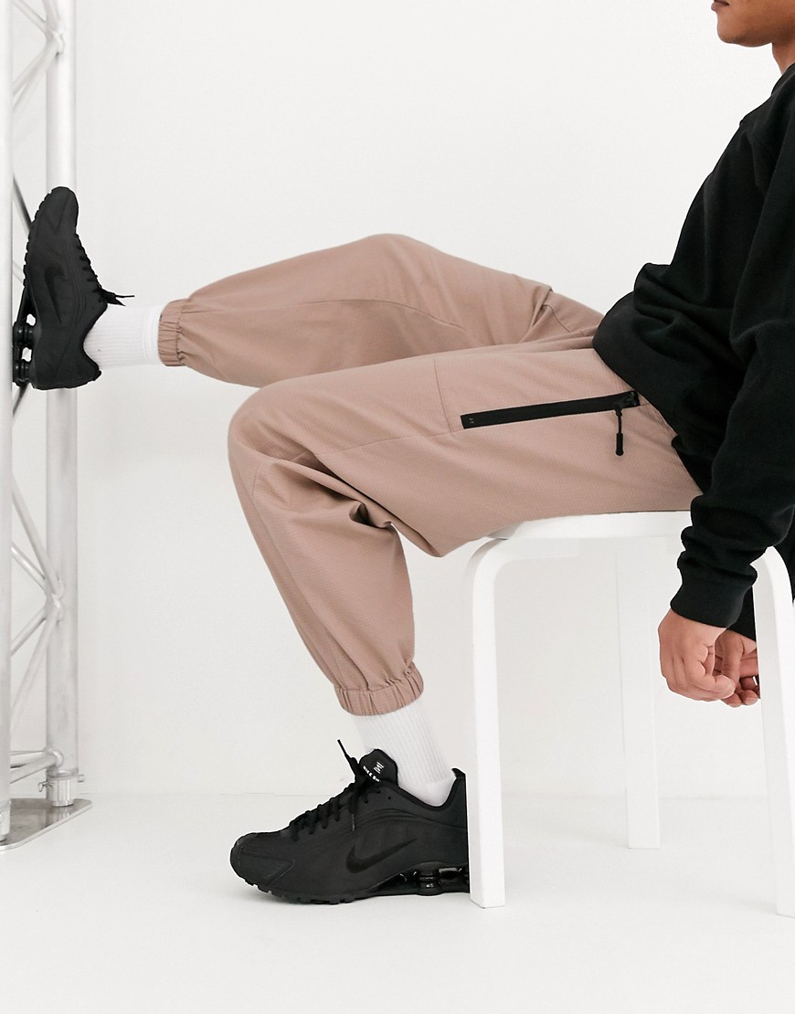 ASOS DESIGN tapered woven joggers in pink
