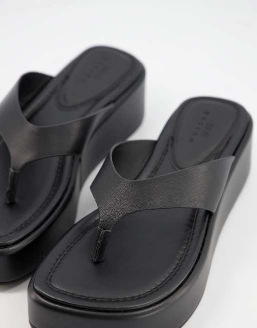 ASOS DESIGN flip flops with angular wedge sole in black - ShopStyle