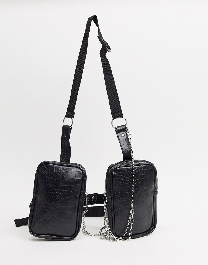 asos design -  – Tasche aus schwarzem Kunstleder mit Riemen- und Kettendetail