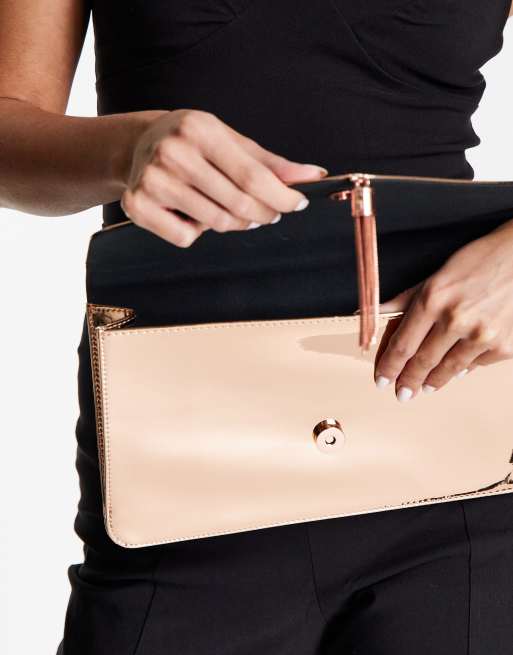 ASOS DESIGN tassel clutch bag in rose gold