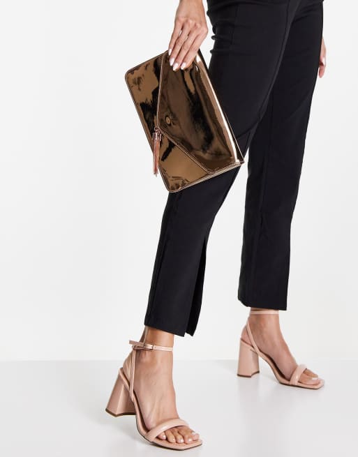 ASOS DESIGN tassel clutch bag in rose gold