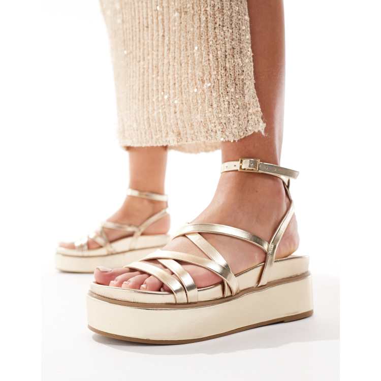 ASOS DESIGN Taurus 2 strappy flatform sandals in gold ASOS