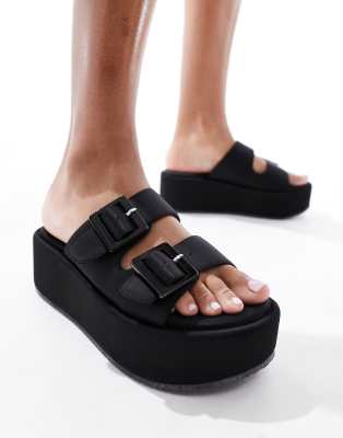 ASOS Design - Taxon - Mule-Sandalen in Schwarz mit Schnalle und Plateausohle