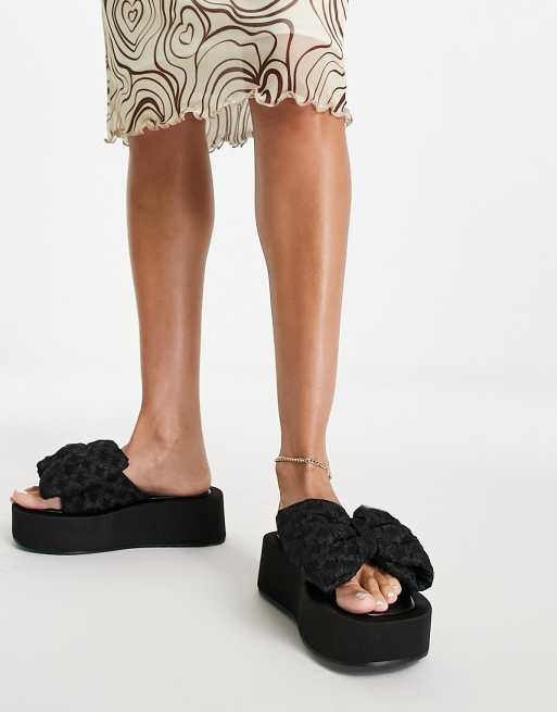 ASOS DESIGN - Teach - Sorte flatform-mules med sløjfe