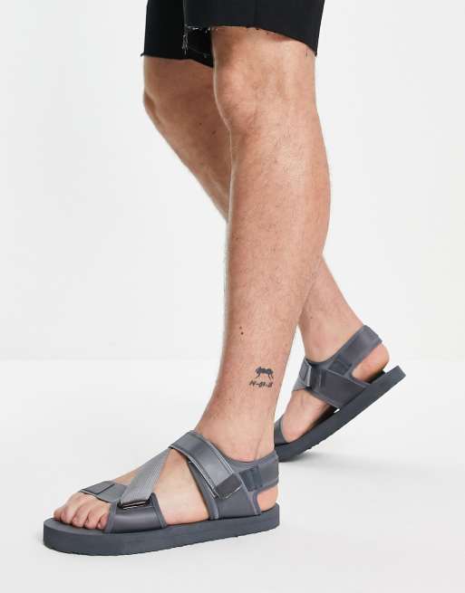 ASOS DESIGN slip on sandals in brown monogram print