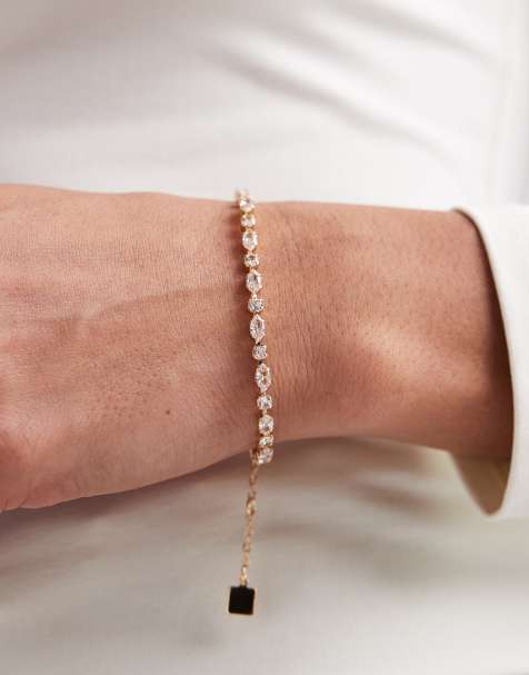 ASOS DESIGN tennis bracelet with cubic zirconia stone details in gold tone in gift bag - view 1