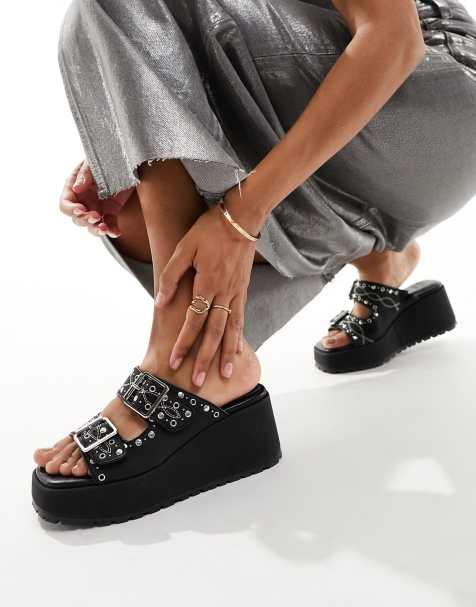 ASOS DESIGN Texas buckle detail studded wedge mules in black - view 1