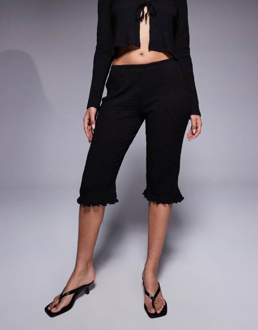 ASOS DESIGN texture capri pants with ruffle edge in black