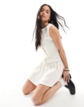 [ASOS DESIGN] ASOS DESIGN texture sleeveless dropped waist mini dress with pearlised buttons in cream-White M Oatmeal