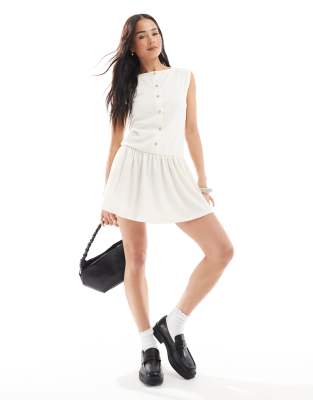 ASOS DESIGN TEXTURE SLEEVELESS DROPPED WAIST MINI DRESS WITH PEARLIZED BUTTONS 
