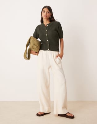 textured boucle short sleeve cardigan with gold tone buttons in khaki green