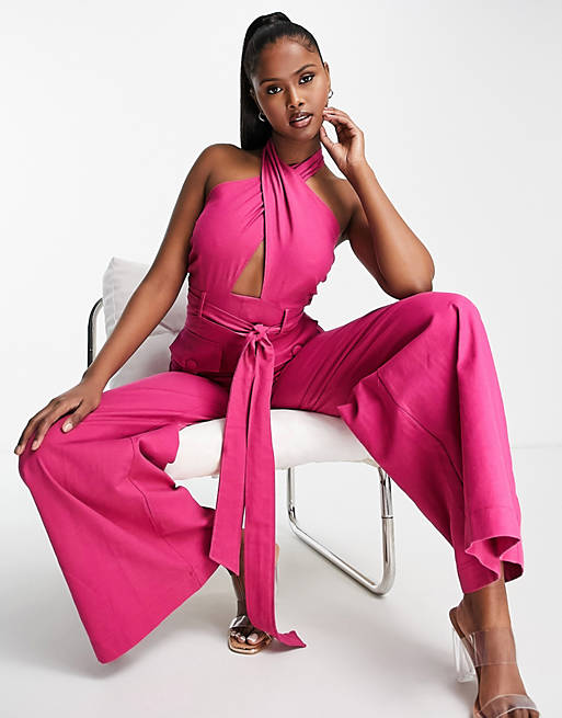 Women textured halter jumpsuit with belt and large pocket in bright pink 