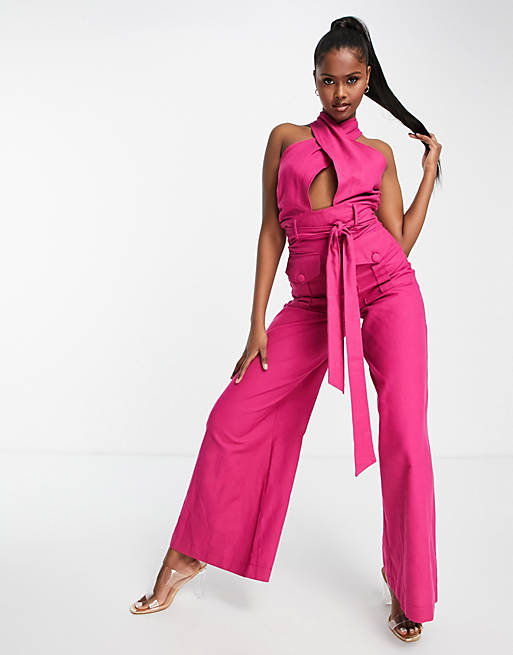 ASOS DESIGN textured halter jumpsuit with belt and large pocket in bright  pink