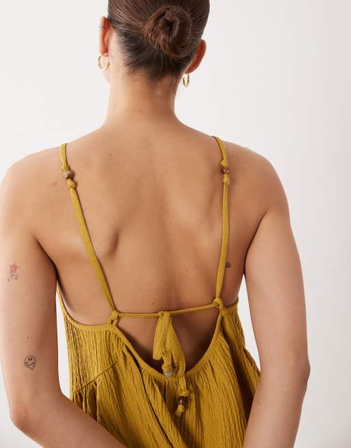 ASOS DESIGN textured halter trapeze mini dress in ocre, 3 of 4