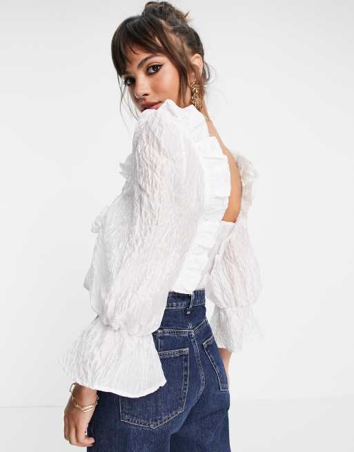 ASOS DESIGN textured jacquard crop top with ruffles and tie front in ivory