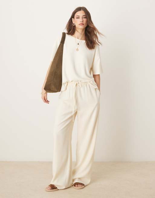 ASOS DESIGN textured knit handkerchief hem tee in cream 