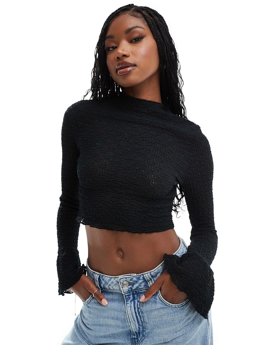 ASOS DESIGN textured long sleeve top with flared cuffs in black