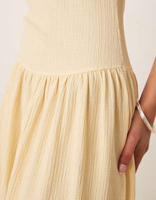 ASOS DESIGN textured maxi dress with dropped waist in buttermilk