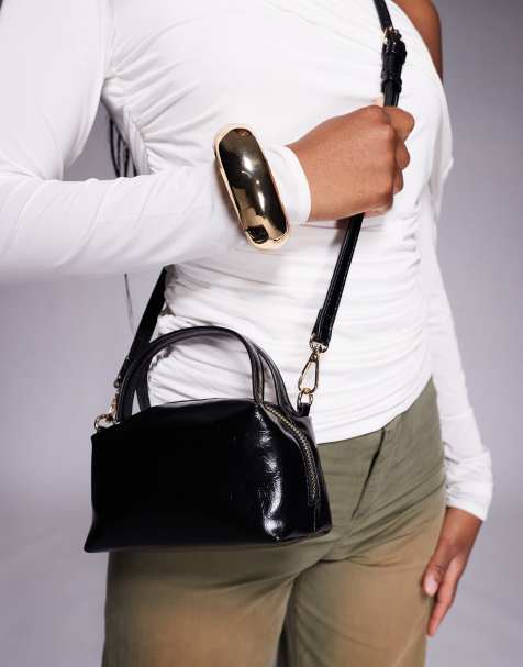 ASOS DESIGN textured mini grab clutch with cross body strap in black - view 1