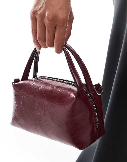 ASOS DESIGN textured mini grab clutch with cross-body strap in cherry red