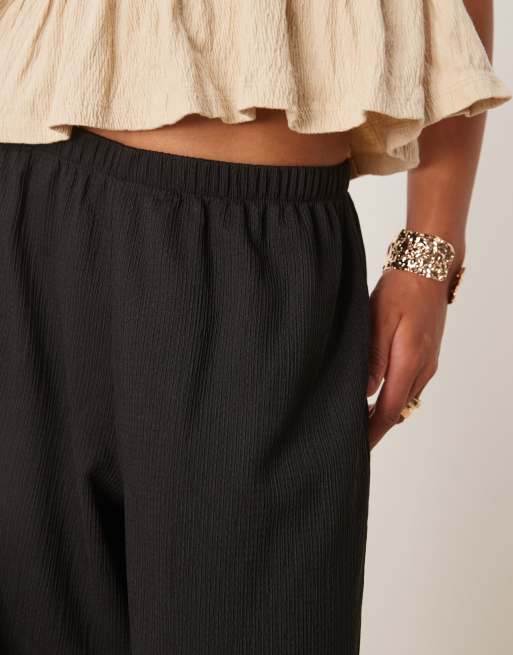 ASOS DESIGN textured oversized cuffed balloon pants in black