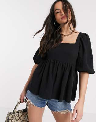 ASOS DESIGN textured peplum top with lace up back in black