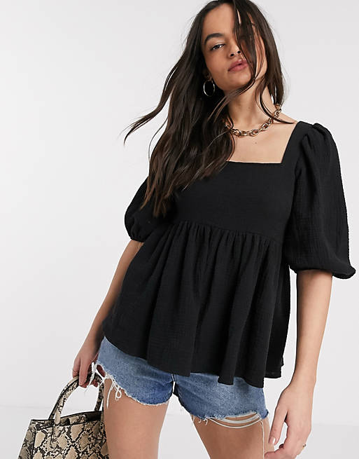 ASOS DESIGN textured peplum top with lace up back in Black