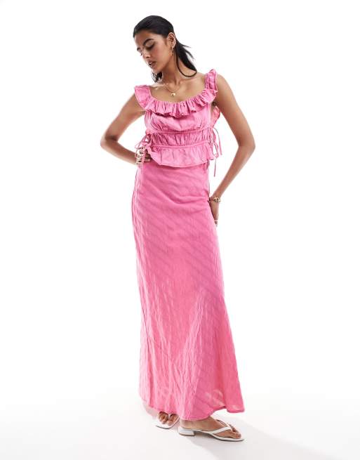 ASOS DESIGN textured ruffle top with side tie detail set in pink