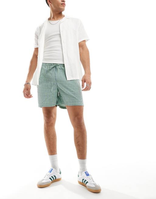 ASOS DESIGN textured shorts in check in green