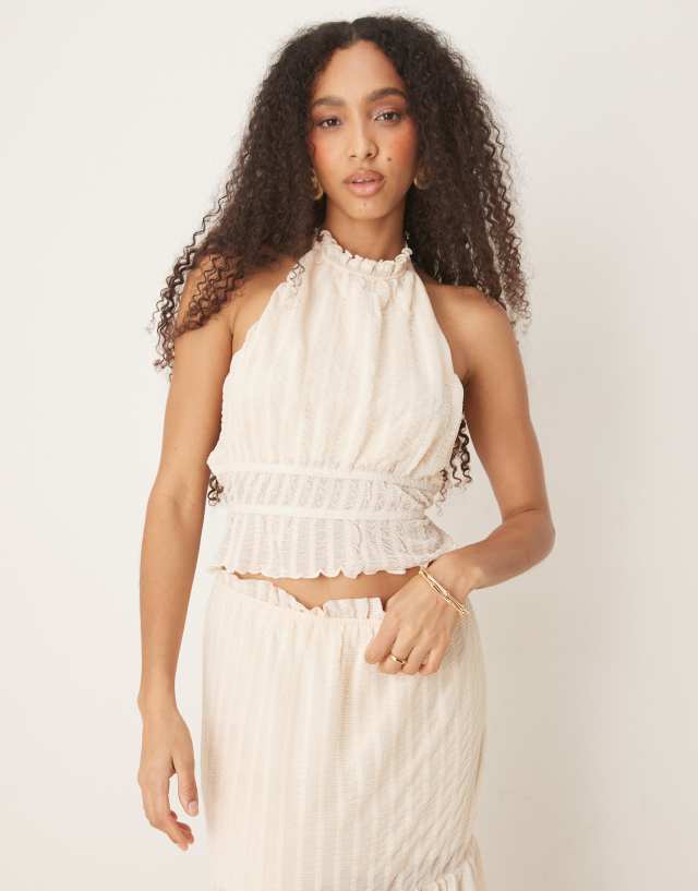 ASOS DESIGN textured sleeveless halter neck top with open back in