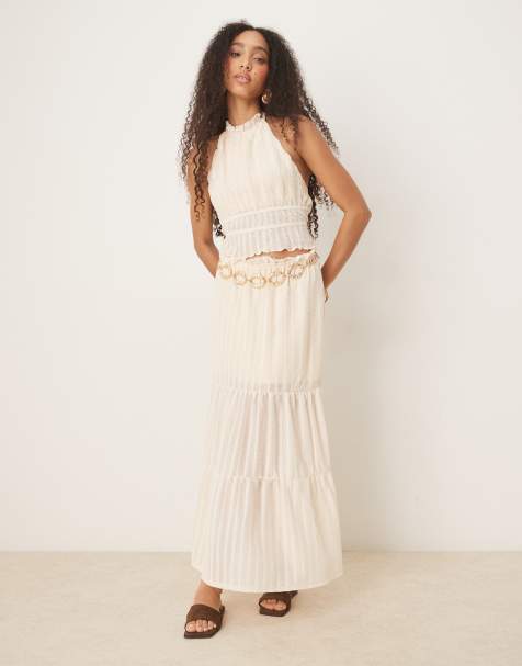 ASOS DESIGN textured sleeveless halter neck top with open back set in cream - view 1
