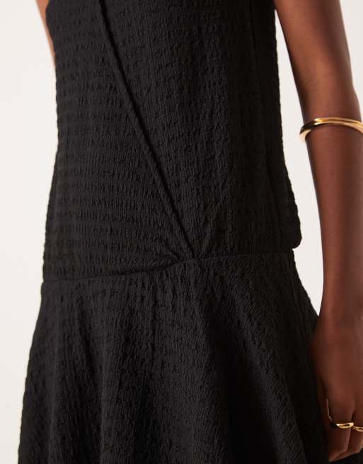 ASOS DESIGN textured sleeveless v-front wrap mini dress with drop waist in black, 3 of 4