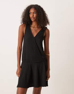 textured sleeveless V front wrap with drop waist mini dress in black