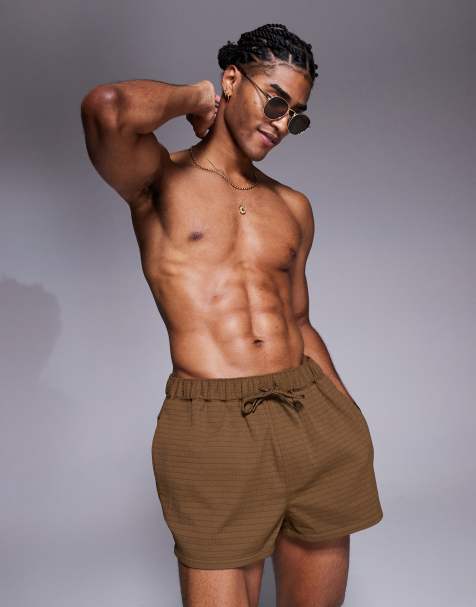 ASOS DESIGN textured swim shorts in super short length in brown - view 1