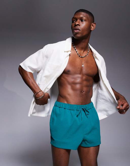 ASOS DESIGN textured swim shorts in super short length in green