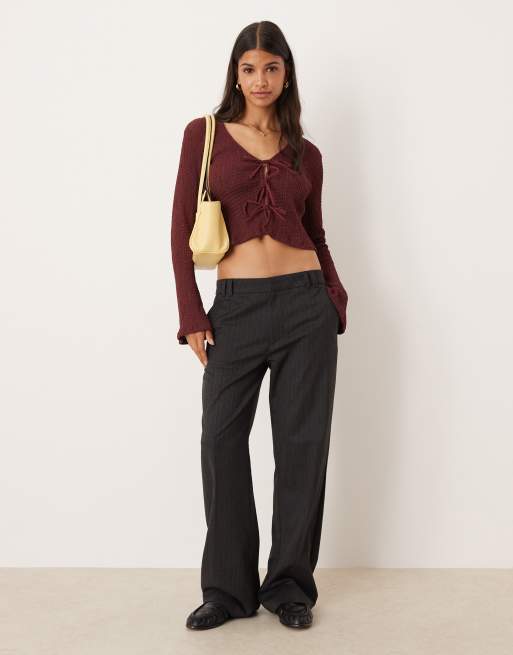 ASOS DESIGN textured tie front long sleeve top in burgundy
