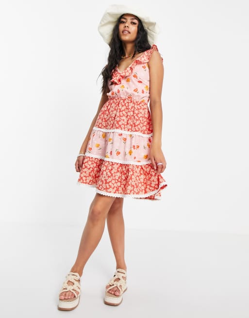 ASOS DESIGN textured tiered mini skater sundress with lace up back in mixed floral