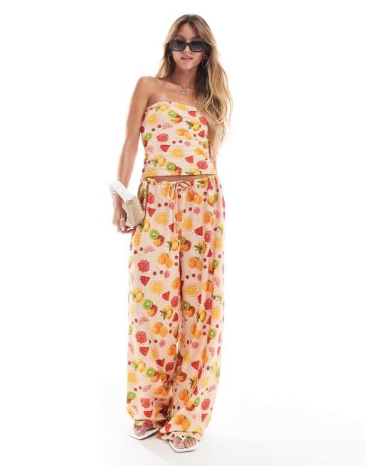 ASOS DESIGN textured wide leg pants in orange fruit print