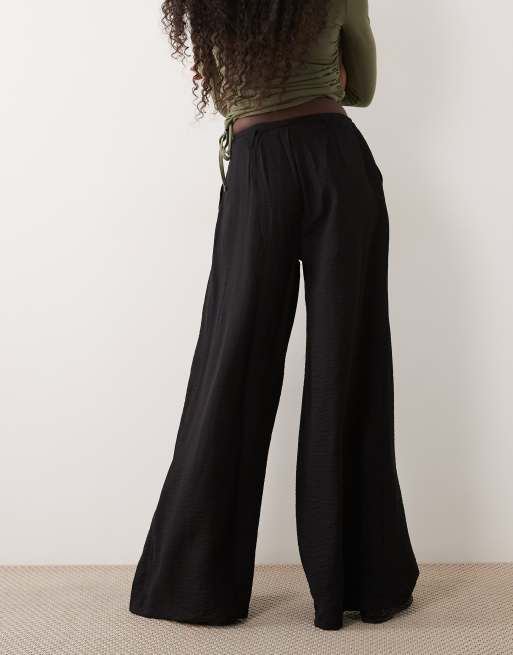ASOS DESIGN textured wide leg pants with tie waist in black, 5 of 5