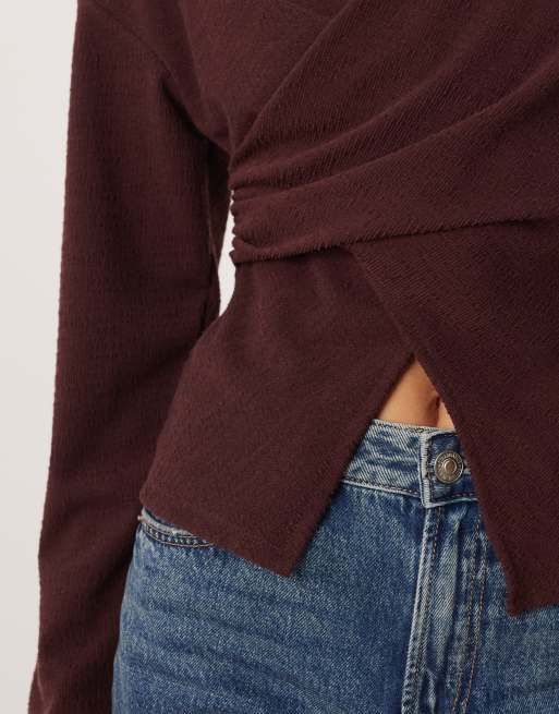 ASOS DESIGN textured wrap detail long sleeve top in burgundy