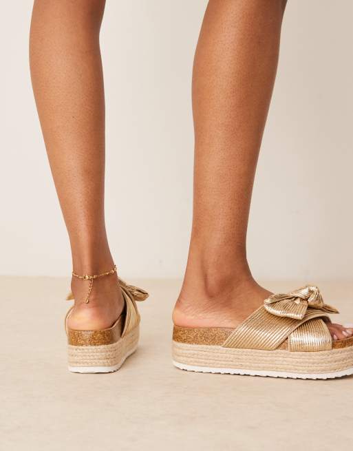 ASOS DESIGN Thankful bow detail flatform sandals in gold