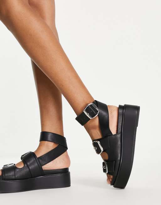 ASOS DESIGN Thistle chunky buckle flatform sandal in black