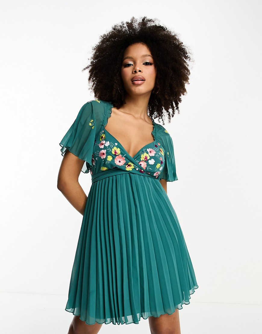 ASOS DESIGN tie back angel sleeve pleated mini dress with embroidered bust in teal-Blue