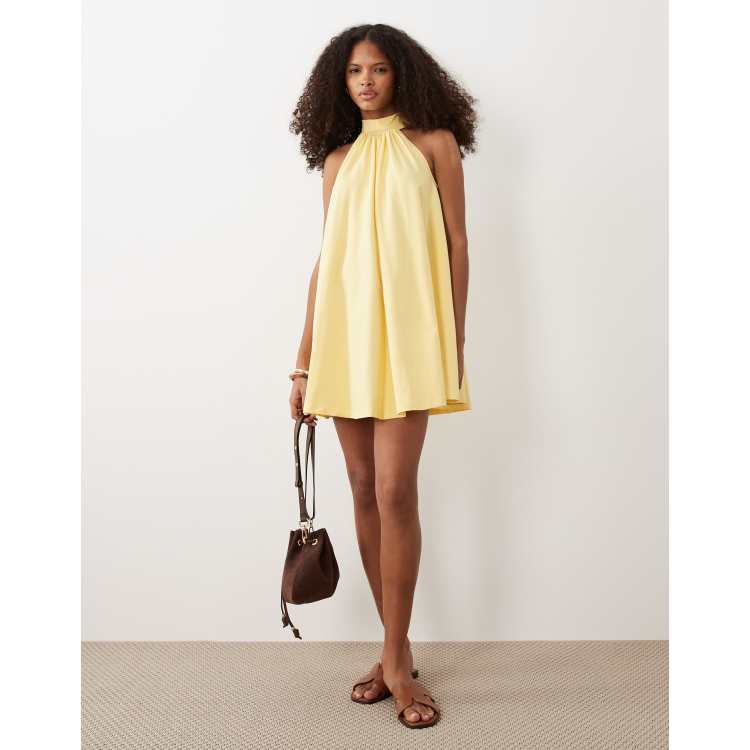 tie up back mini dress in pastel yellow Mini flowing dress with back tie