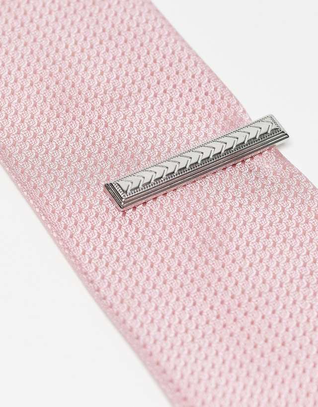 ASOS DESIGN tie bar with arrow embossed detail in silver tone