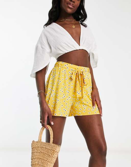 ASOS DESIGN tie belt flippy shorts in mustard ditsy floral