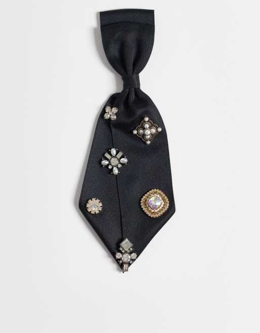 ASOS DESIGN tie-clip in black with multi vintage charms, 1 of 3