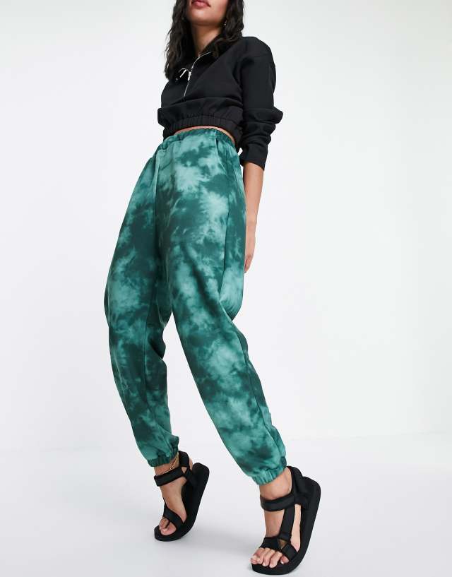 ASOS DESIGN tie dye sweatpants in green